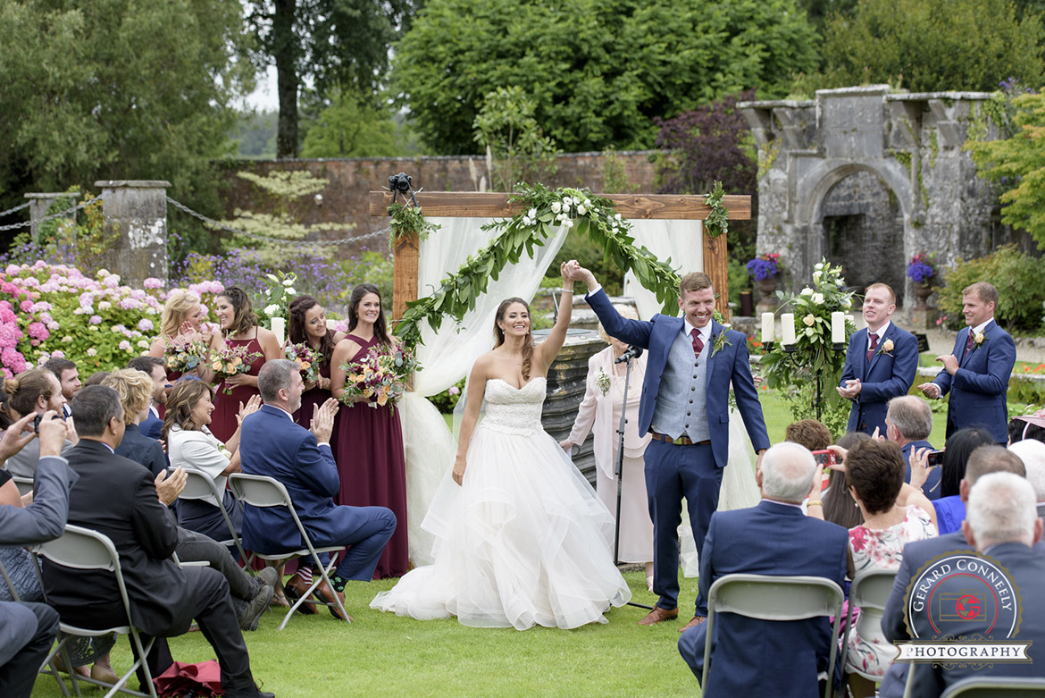 dromoland castle outdoor wedding ceremony in the walled garden